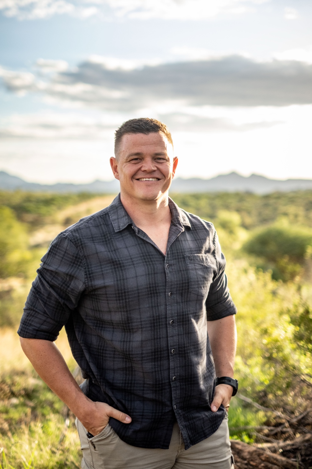 Francois Dames outdoors in a blue checked shirt