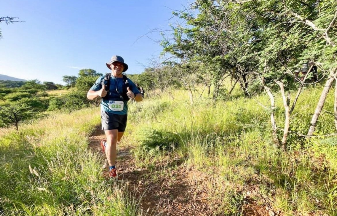 Francois running on a green trail